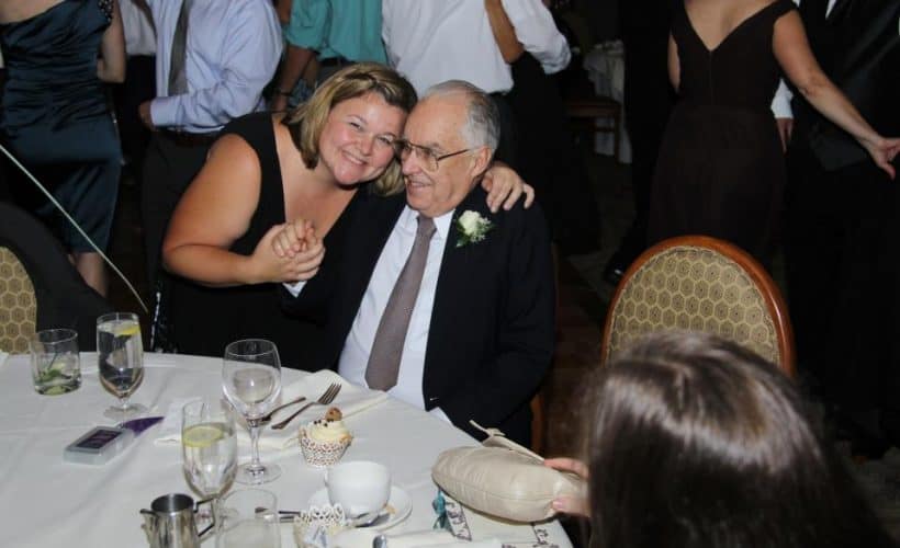 father and adult daughter at wedding