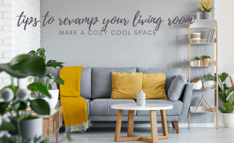 grey couch with mustard cushions in front of grey accent wall