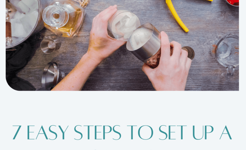 ooverhead view of someone pouring a mixed drink with a lemon squeezer and ice