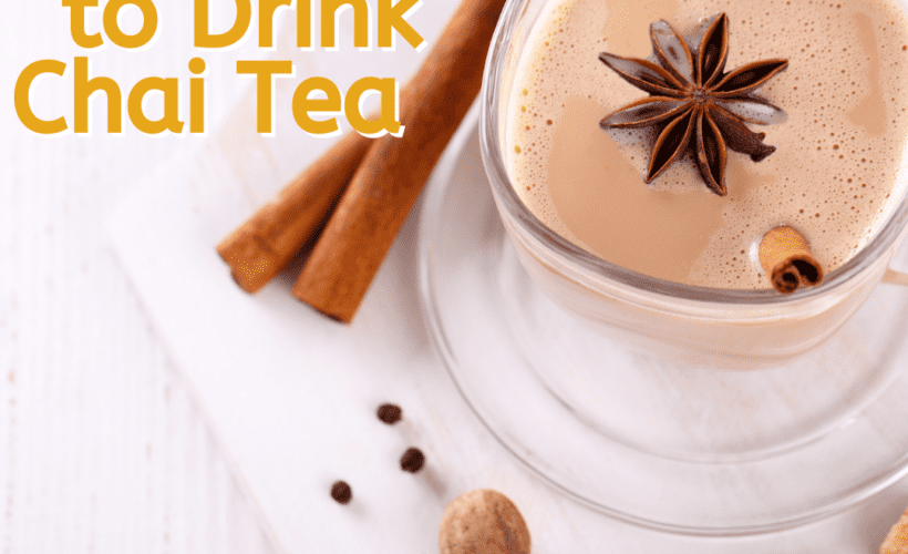 overhead view of a cup of chai tea with cinnamon sticks on a white napkin